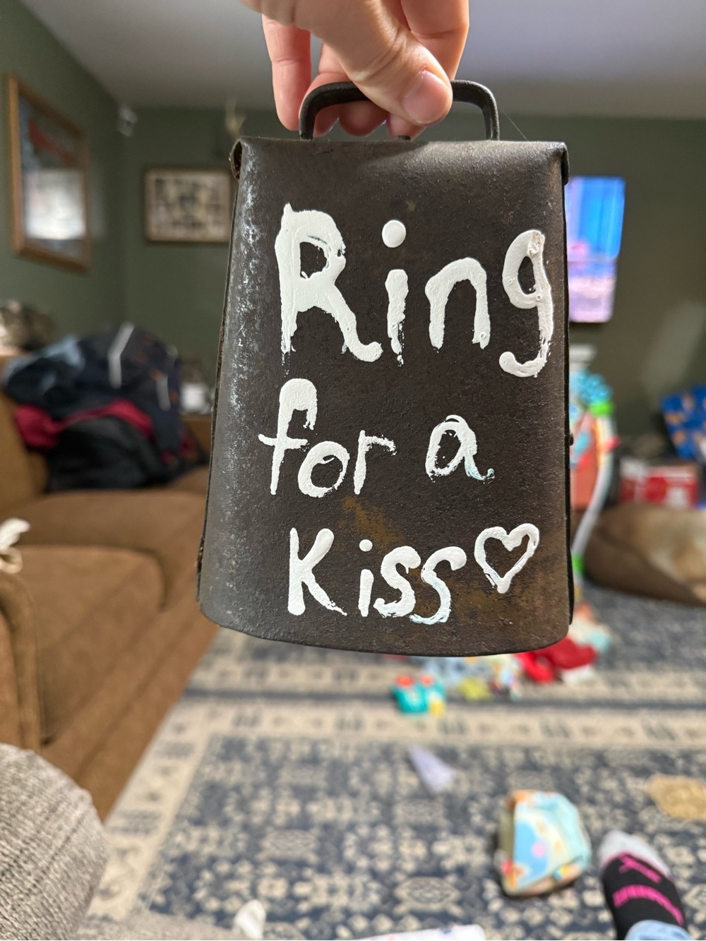 Authentic antique “ring for a kiss” cow bell